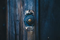 Old doorbell button near a door